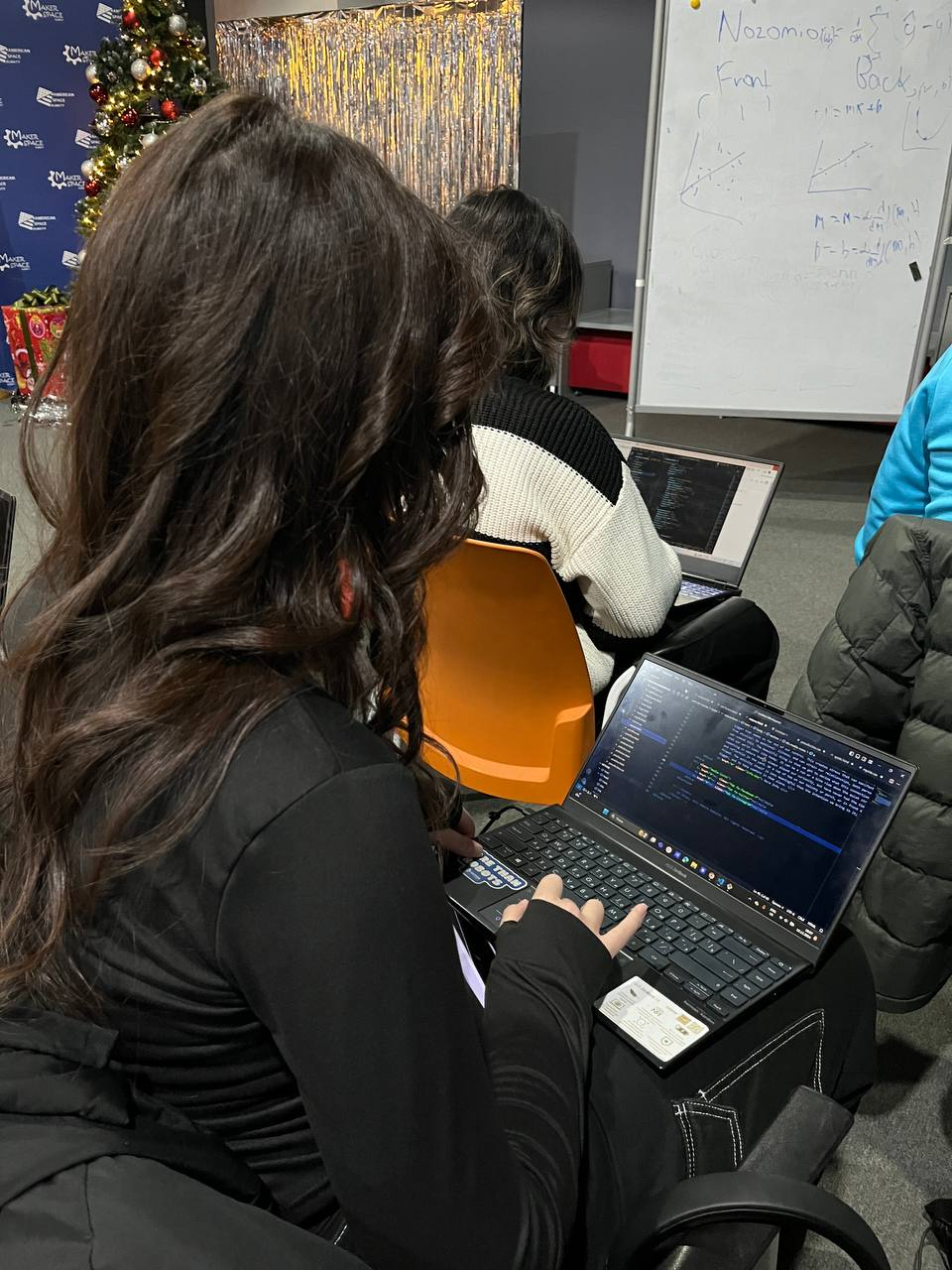 Participants coding during the workshop